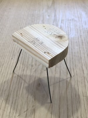 A wire prototype of a chair undercarriage